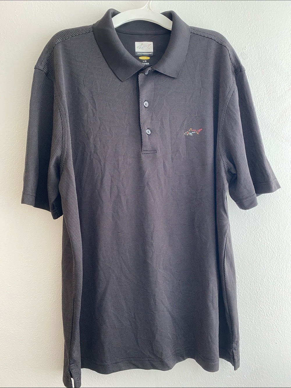 Attack Life by Greg Norman Black Micro-Textured Polo with Shark Embroidery